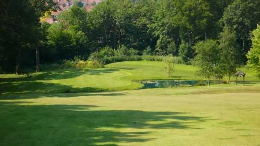 17th green over waterat Bush Hill Park