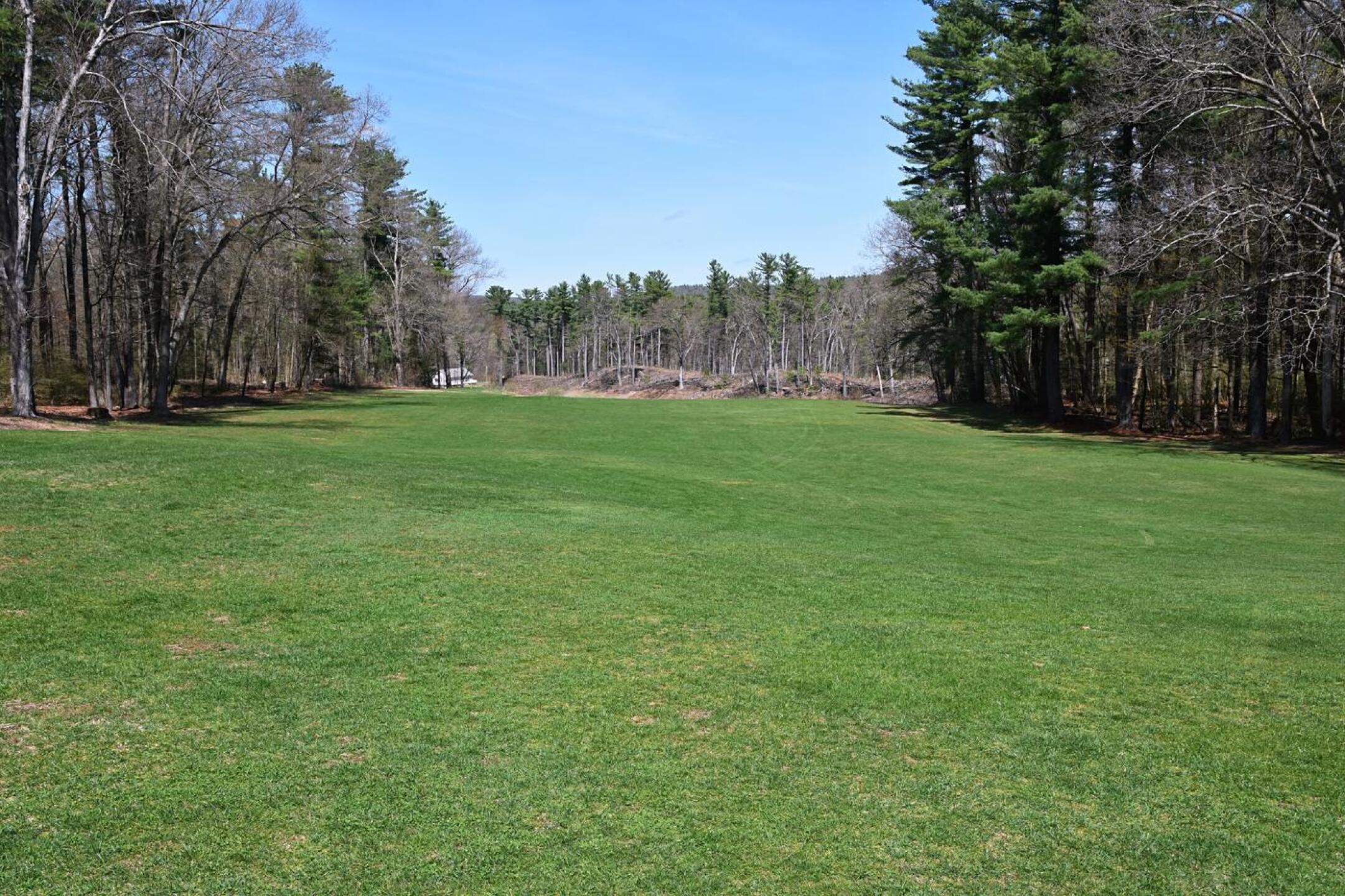 A key challenge on the short par-4 third is the blind drive up a steep hill. This view looks back on the driving zone from the green complex. (Photo submitted by AptlyLinked on 04/19/2026)