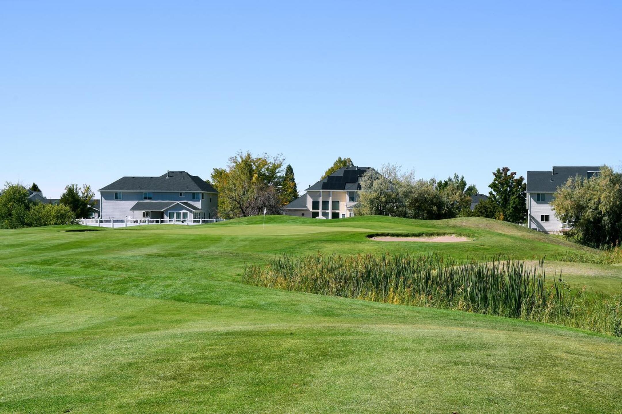 The eighth hole, which challenges the tee shot with its well-guarded landing zone, also demands an accurate approach into this raised and bunker-flanked green. (Photo submitted by AptlyLinked on 10/07/2025)