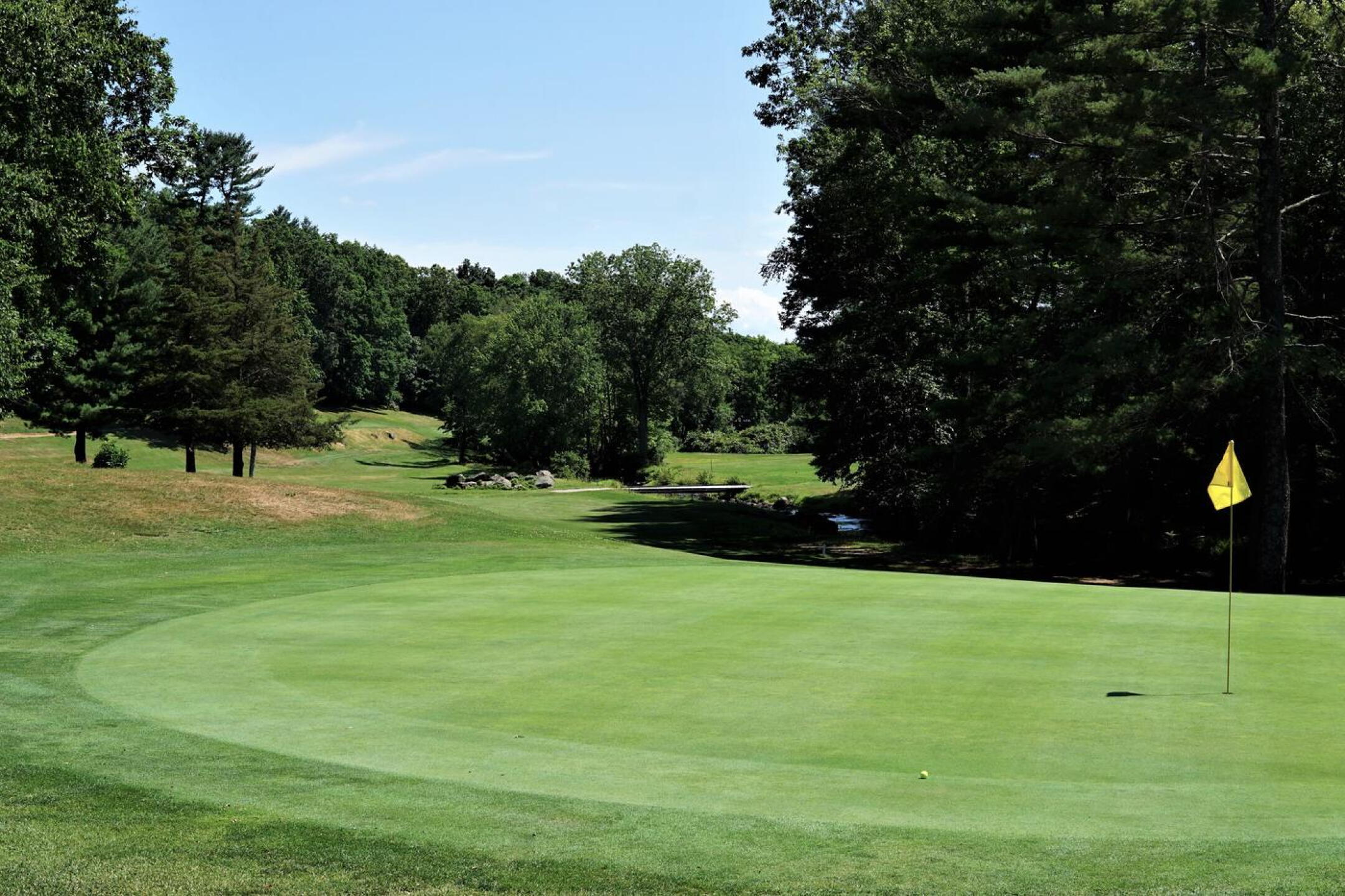 Sixteen is a handsome golf hole. The same bridge now lies in the far background. (Photo submitted by AptlyLinked on 07/18/2022)