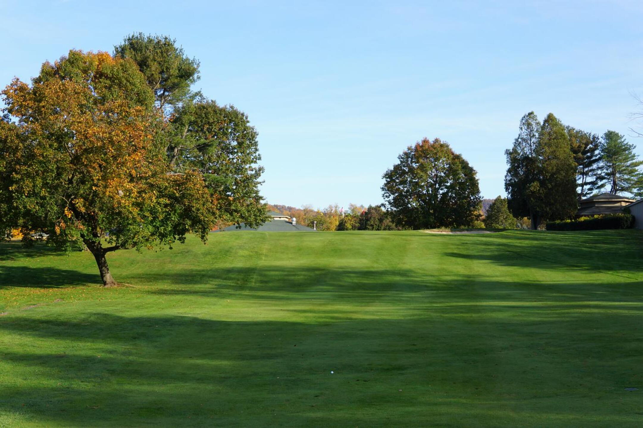 A view from the rolling ninth fairway to the green ahead and clubhouse, right. (Photo submitted by AptlyLinked on 10/24/2022)